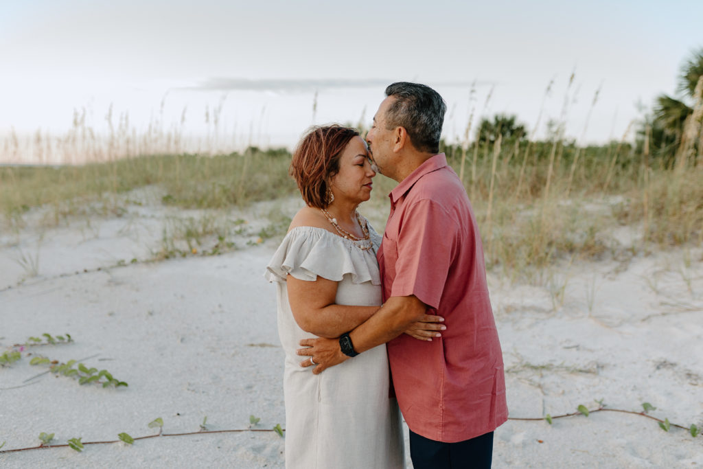 A couples photo of the grandparents at an extended family beach photography session in Treasure Island, Florida by Michelle Medina Photography.