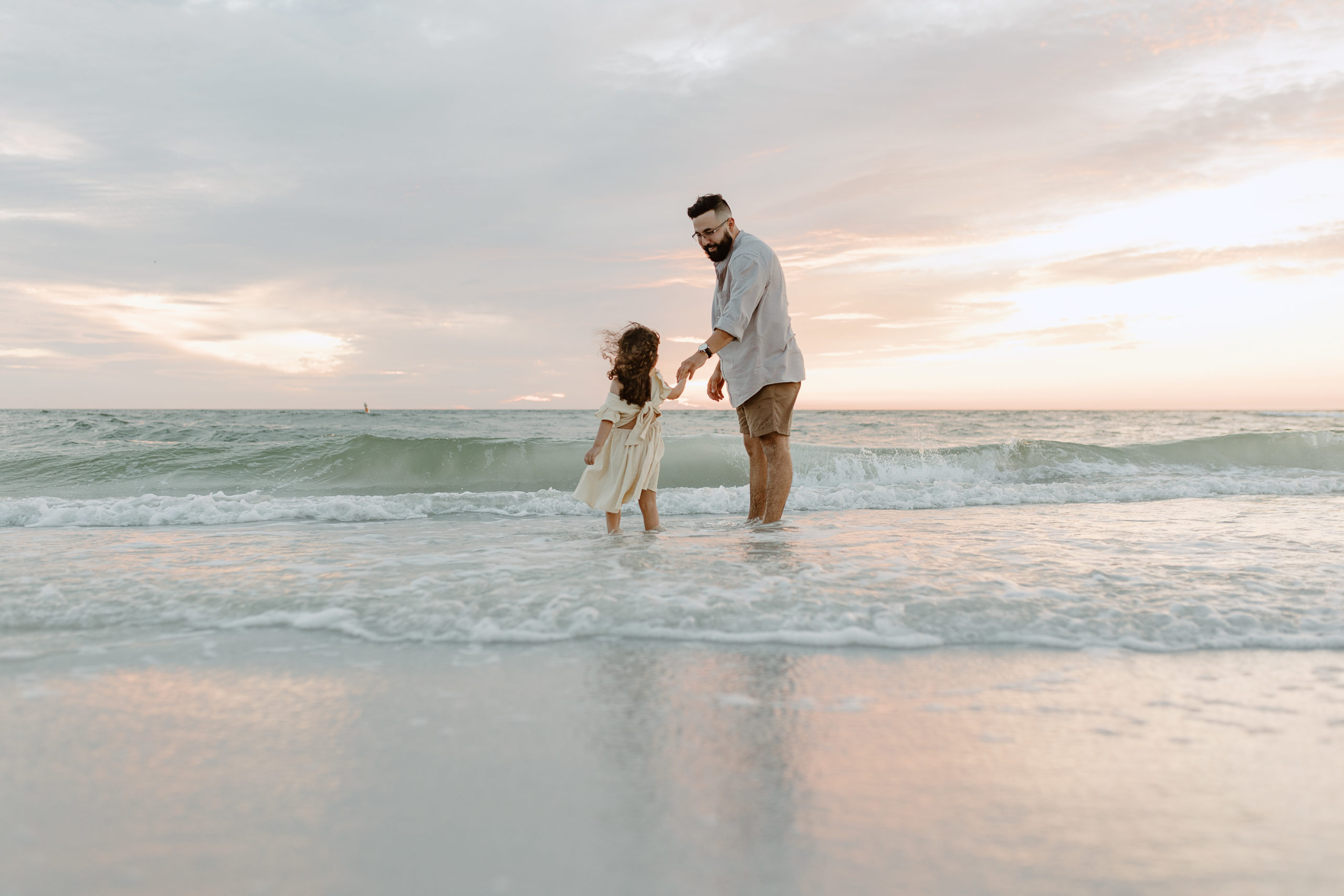 Sunset beach photography with father and daughter by Michelle Medina Photography.