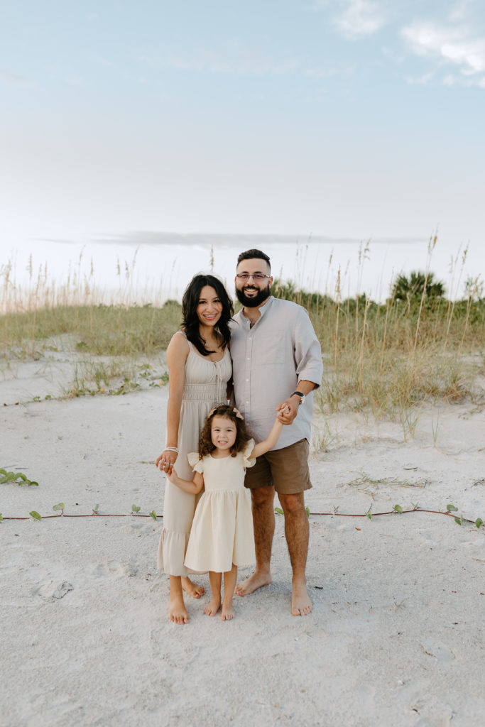 A single family on the beach in Treasure Island, Florida by family beach photographer Michelle Medina. 