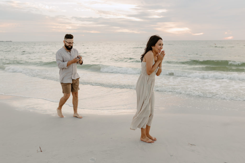 A surprise proposal on the beach by Michelle Medina Photography. 
