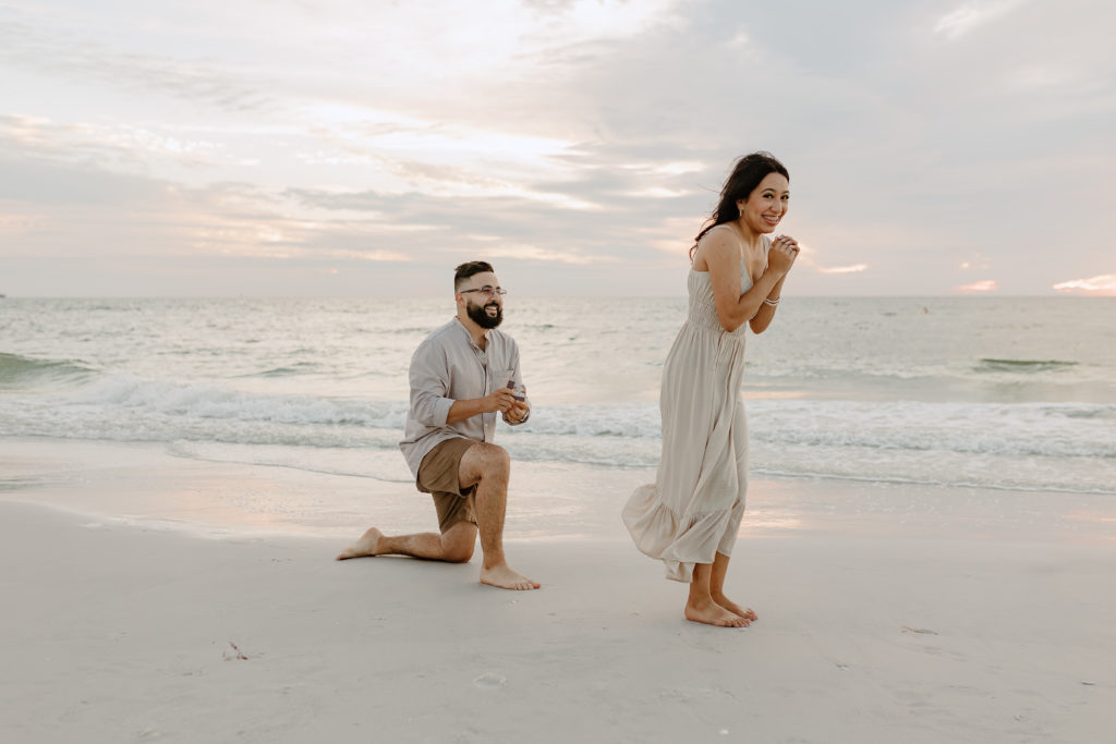 An extended family session with a proposal. Taken by Michelle Medina Photography in Treasure Island, Florida. 